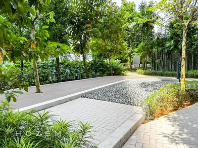 a garden with a road and trees and a sidewalk at 2BR2B Hozem KL1713 Apartment Bukit Bintang in Kuala Lumpur