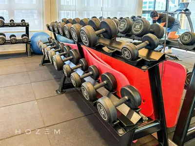 a row of dumbbells on display in a gym at 2BR2B Hozem KL3214 Apartment Bukit Bintang in Kuala Lumpur