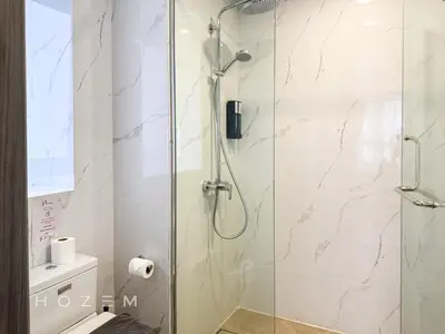 a bathroom with a shower with a glass door at 2BR2B Hozem KL3214 Apartment Bukit Bintang in Kuala Lumpur