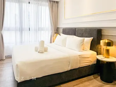 a bedroom with a bed with a stuffed animal on it at 2BR2B Hozem KL3214 Apartment Bukit Bintang in Kuala Lumpur