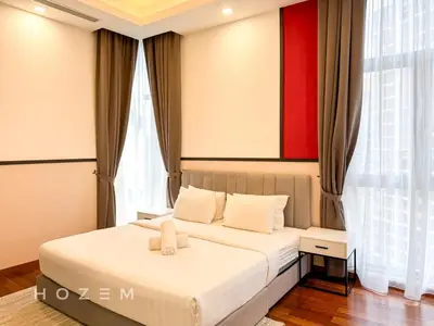 a bedroom with a bed and a red painting on the wall at 2BR2B Hozem KL2903 Apartment KLCC in Kuala Lumpur