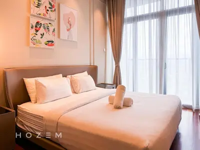 a bedroom with a bed with a teddy bear on it at 2BR2B Hozem KL3802 Apartment KLCC in Kuala Lumpur