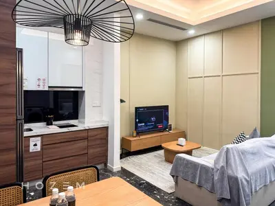 a living room with a tv and a couch and a table at 2BR2B Hozem KL4207 Apartment KLCC in Kuala Lumpur