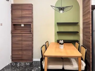 a dining room with a wooden table and chairs at 2BR2B Hozem KL4207 Apartment KLCC in Kuala Lumpur