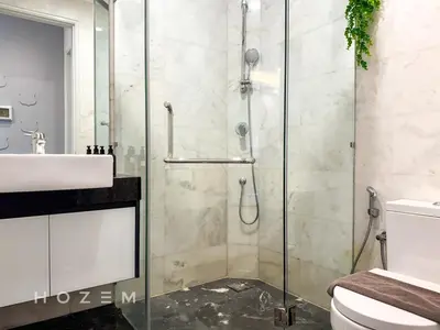 a bathroom with a shower and a sink and a toilet at 2BR2B Hozem KL3709 Apartment KLCC in Kuala Lumpur
