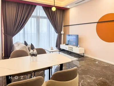 a room with tables and chairs and a tv at 2BR2B Hozem KL5009 Apartment KLCC in Kuala Lumpur