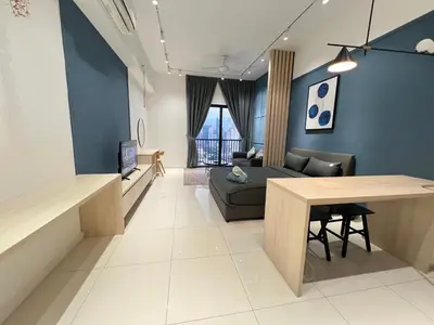 a living room with a couch and a table at Chambers Residence by Golden Homestay in Kuala Lumpur