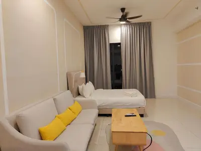 a living room with a couch and a bed at Chambers Residence by Fancy House in Kuala Lumpur