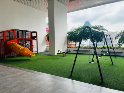 a room with a playground with a slide at Chambers Residence by Fancy House in Kuala Lumpur