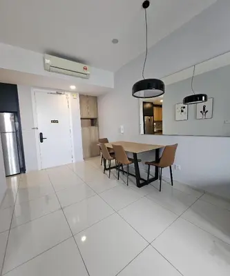 a kitchen and dining room with a table and chairs at The Signature Suites at Robertson Bukit Bintang in Kuala Lumpur