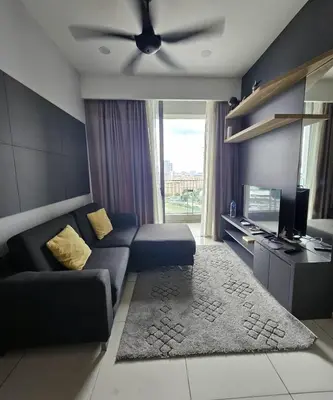 a living room with a couch and a ceiling fan at The Signature Suites at Robertson Bukit Bintang in Kuala Lumpur