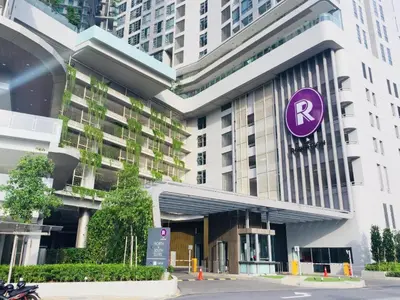 a building with a purple sign on the side of it at The Signature Suites at Robertson Bukit Bintang in Kuala Lumpur