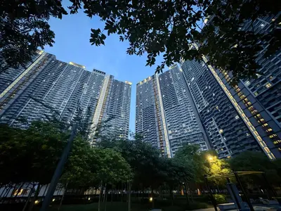 two tall buildings in a city at night at M Vertica Residence by Dynasty in Kuala Lumpur