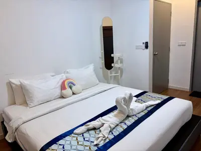 a bedroom with a bed with stuffed animals on it at M Vertica Residence by Dynasty in Kuala Lumpur