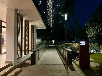 a walkway next to a building with a street light at M Vertica Residence by Dynasty in Kuala Lumpur
