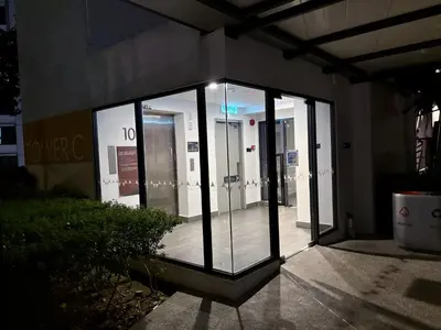 a group of glass doors in a building at M Vertica Residence by Dynasty in Kuala Lumpur