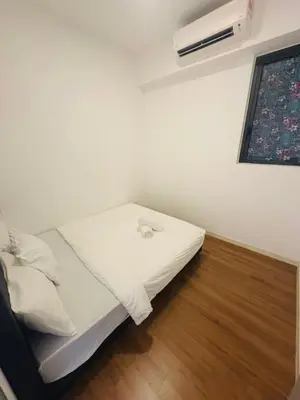 a white bed in a room with a window at M Vertica Residence by Dynasty in Kuala Lumpur