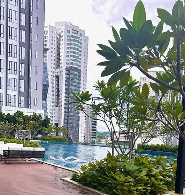 a view of a pool in a city with tall buildings at KL Central 32 Floor KLCC View in Kuala Lumpur