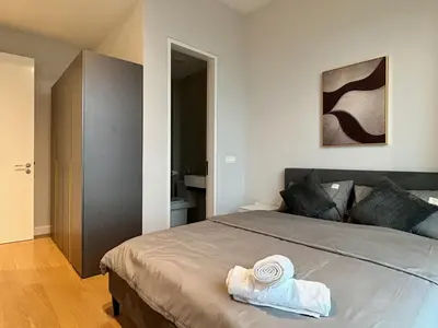 a bedroom with a bed with towels on it at KL Central 32 Floor KLCC View in Kuala Lumpur