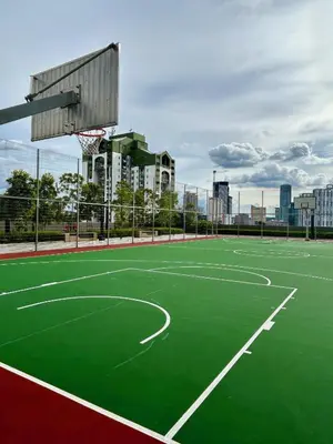 an empty basketball court with a basketball hoop at KL Central 32 Floor KLCC View in Kuala Lumpur