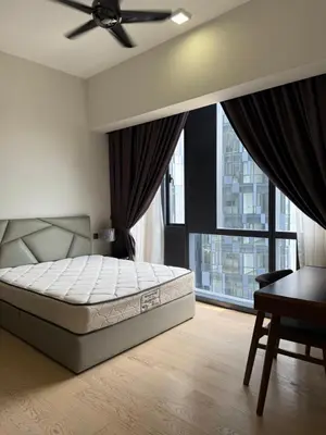 a bedroom with a bed and a ceiling fan at Star Residences One in Kuala Lumpur
