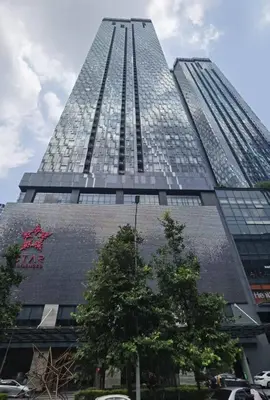 a tall building with a lot of windows at Star Residences One in Kuala Lumpur