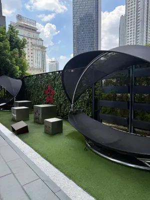 a slide on the side of a building with green grass at Star Residences One in Kuala Lumpur