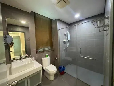 a bathroom with a toilet and a sink and a shower at Summer Suites KLCC Apartments by Soulasia in Kuala Lumpur