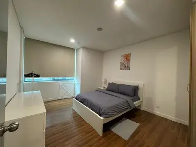a bedroom with a bed and a window in it at Summer Suites KLCC Apartments by Soulasia in Kuala Lumpur