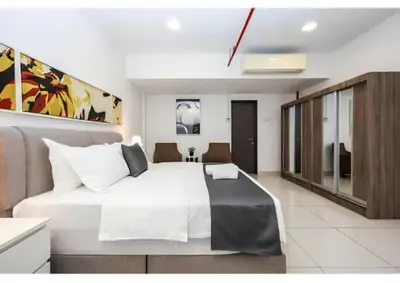 a bedroom with a large white bed in a room at Bmc Homez Suite 3towers in Kuala Lumpur