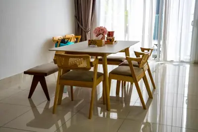 a dining room table and chairs in a room at Entire Apartment in Kuala Lumpur, Infinity Pool!! in Kuala Lumpur