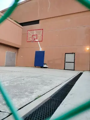 an empty basketball hoop on the side of a building at Global suites at time square KL in Kuala Lumpur