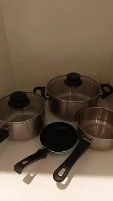 a group of three pots and pans on a counter at Quill Residence- City View Condo by Azmila in Kuala Lumpur