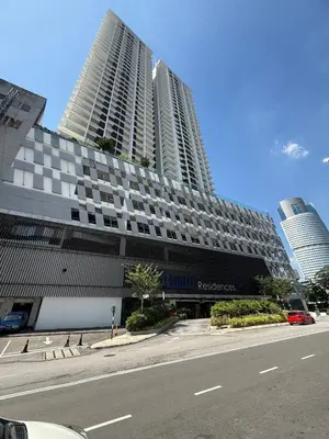 a large building on a street in front of a building at Quill Residence- City View Condo by Azmila in Kuala Lumpur