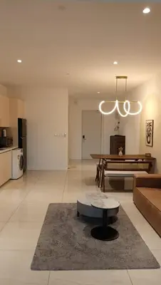 a living room with a couch and a table at Quill Residence- City View Condo by Azmila in Kuala Lumpur