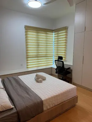 a bedroom with a bed and a chair and a window at Mont kiara warmly 6 pax stay in Kuala Lumpur