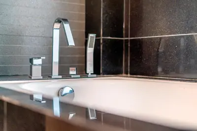 a bathroom with a sink and a bath tub at Dua Sentral Kuala Lumpur near KL Sentral in Kuala Lumpur
