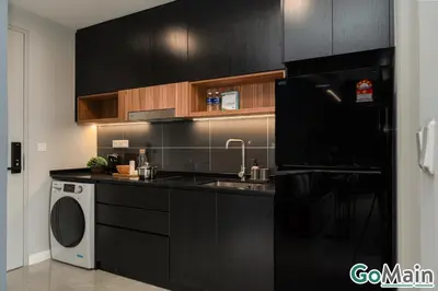 a black kitchen with a sink and a dishwasher at AXON BUKIT BINTANG w Skypool - Walk to Pavilion KLCC KL TRX in Kuala Lumpur