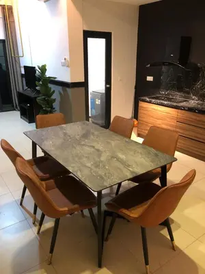 a table and chairs in a room with a kitchen at Cozy Stay in KLCC\u5409\u9686\u73bb in Kuala Lumpur