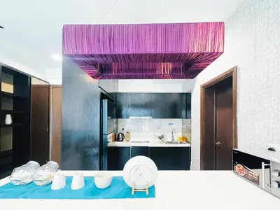 a kitchen with a purple ceiling and a counter top at Regalia Residences And Suites By The Relaxstay in Kuala Lumpur