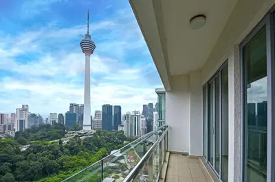 a balcony with a view of the seattle skyline at Palette Bukit Bintang Formerly Suasana Suites in Kuala Lumpur