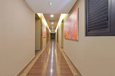 a long hallway with paintings on the walls at Palette Bukit Bintang Formerly Suasana Suites in Kuala Lumpur