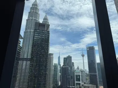 a view of a city with tall skyscrapers at Star Residences One in Kuala Lumpur