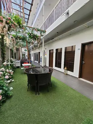 a courtyard with a tub in the middle of a building at V Garden Hotel by Minsu in Kuala Lumpur