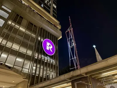 a purple parking sign on the side of a building at Cozy Minimalist Condo In The Heart of Kuala Lumpur City 1BR in Kuala Lumpur