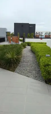 a walkway in front of a building with plants at KL Comfy Masterbedroom wt bathroom in Kuala Lumpur