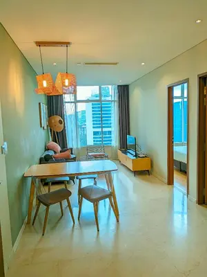 a living room with a dining room table and chairs at Sky Suite KLCC By near klcc in Kuala Lumpur