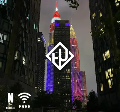 a tall building with a sign in front of it at Comfy 1 BR unit 2 mins from KLCC in Kuala Lumpur