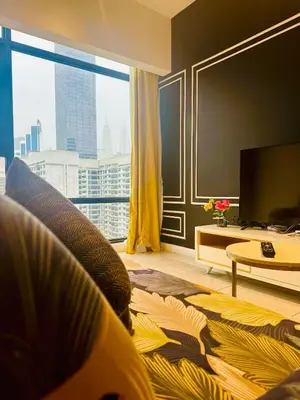 a living room with a large window and a tv at AXON RESiDENCE AT SERViCE APARTMENT in Kuala Lumpur