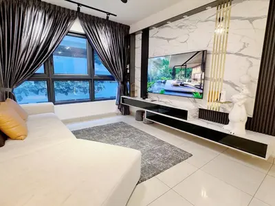 a living room with a tv and a white couch at Kuala Lumpur M Vertica Residence I Big Family Homestay \u5927\u5bb6\u5ead\u9002\u4f4f I Walking distance to MRT I \u9a6c\u4e2d\u82f1\u6587\u670d\u52a1 I Malay English Chinese in Kuala Lumpur